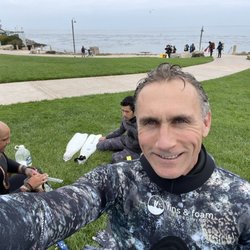 Getting ready at San Carlos beach, Monterey with the protected, still ocean bay (full of beautiful kelp forests) in the background.