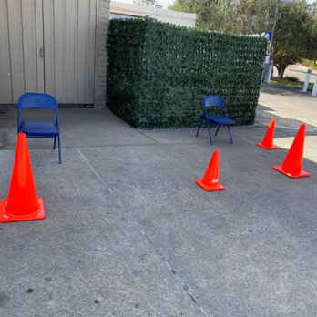 Ron Cromwell Chevron Star Smog - a row of orange traffic cones in front of a building - Smog Check Stations Near Me - Novato, California Ron Cromwell Chevron Star Smog - a row of orange traffic cones in front of a building - Smog Check Stations Near Me - Novato, California