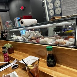 Ugly Tuna Sushi - Zoom to see the unorganized gross station, and the white claw the chef was drinking.