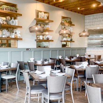 Pho Social - a dining room with tables and chairs - Coffee & Tea Near Me - Columbus, Ohio