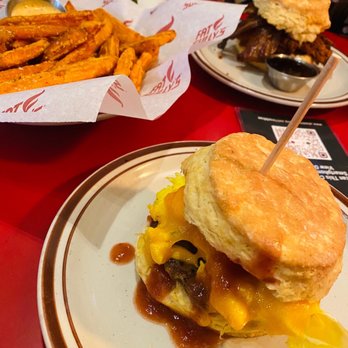 Atomic Cowboy - Colfax - a burger and french fries on a plate - Cocktail Bars Near Me - Denver, Colorado