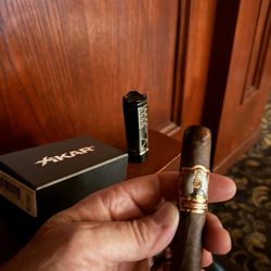 Boyd's Tobacco & Elegant Gifts - Xikar lighter, and Cigar