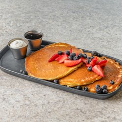 Good Kitchen - Gluten-free pancakes with a seasonal topping, whipped butter and real maple syrup