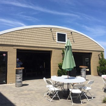 Greenport Harbor Brewing - Looks like an old hanger, but there's a lot more in there than scrap metal. - Breweries Near Me - Peconic, New York Greenport Harbor Brewing - Looks like an old hanger, but there's a lot more in there than scrap metal. - Breweries Near Me - Peconic, New York