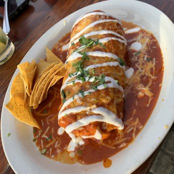 El Chupacabra - al pastor wet burrito with red sauce - Bars Near Me - Seattle, Washington El Chupacabra - al pastor wet burrito with red sauce - Bars Near Me - Seattle, Washington