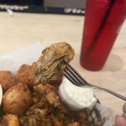 Papa Dubi's - Plump oyster from the Blackened Seafood Combo