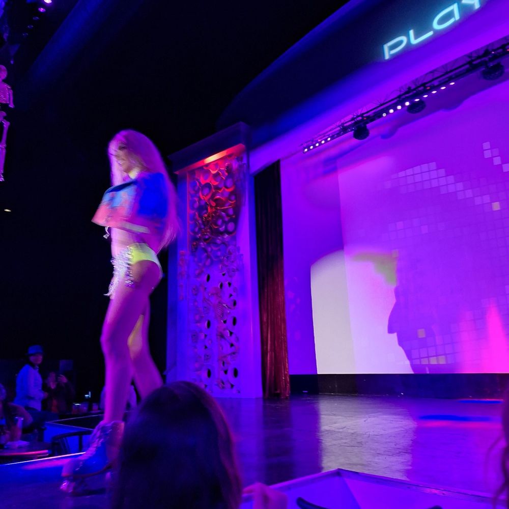 Play - a woman walking on a runway at night - Dance Clubs Near Me - Louisville, Kentucky Play - a woman walking on a runway at night - Dance Clubs Near Me - Louisville, Kentucky