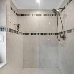 Accurate Glass - new install of frameless shower door and panel