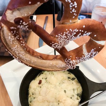 OAK - OAK Pretzel + Veggie Dip- Warm salted bavarian pub pretzel. kale + artichoke dip. shaved parmesan. - Bars Near Me - Gainesville, Florida