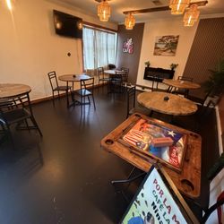Nina’s Cafe - Indoor seating and dominoes table