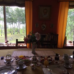 Arcona House on the Lake Bed & Breakfast - The dining room is set up right in front of two large windows looking out into the lake. This is perfect.