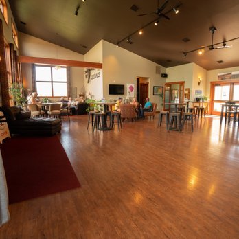 WIT Cellars - a woman standing in a wine cellar - Wine Tasting Room Near Me - Prosser, Washington