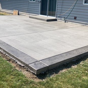 Landscape Creations - a concrete patio in a backyard - Masonry/Concrete Near Me