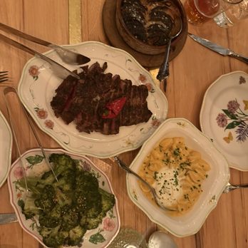 Supperland - Top dish - blackened onions Middle- medium rare ribeye steak Bottom left- bone marrow broccoli  Bottom right- miso Mac n' cheese - Southern Near Me - Charlotte, North Carolina