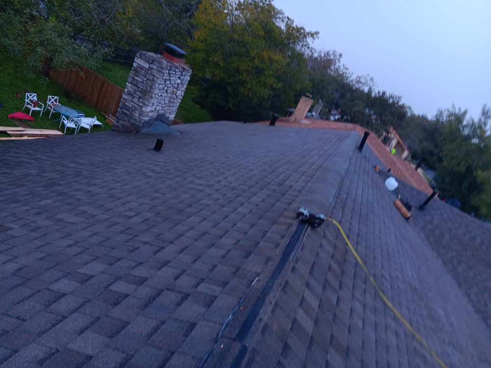 Slide of Pinedas Roofing Company