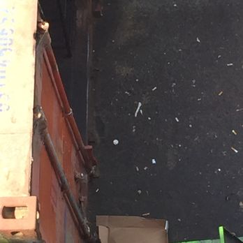 Cha Cha Cha - The shipping container holds "fresh" fruit & veggies. The white things on the ground are cigarette buds. - Caribbean Near Me - San Francisco, California