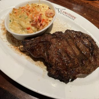 LongHorn Steakhouse - The beginning of the outlaw ribeye, on the orher side was where all the charred bits are which was bitter - Steakhouses Near Me - Round Rock, Texas