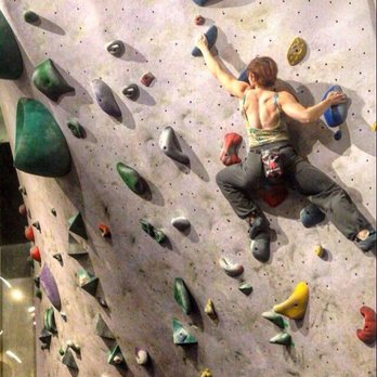 Bouldering Project - Poplar - Spectrum Dance Theater company member Blair Elliot cross training on a route at the Seattle Bouldering Project. - Yoga Near Me - Seattle, Washington