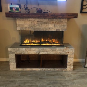 All inclusive tile and stone - a fireplace with a flat screen tv - General Contractors Near Me - Sun Valley, Nevada All inclusive tile and stone - a fireplace with a flat screen tv - General Contractors Near Me - Sun Valley, Nevada