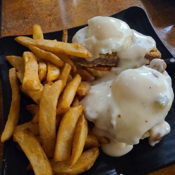 My Cafe - Chicken fried steak benedict on a sweet flat biscuit, topped with breakfast gravy instead of hollandaise sauce. - Breakfast & Brunch Near Me - Newark, California My Cafe - Chicken fried steak benedict on a sweet flat biscuit, topped with breakfast gravy instead of hollandaise sauce. - Breakfast & Brunch Near Me - Newark, California