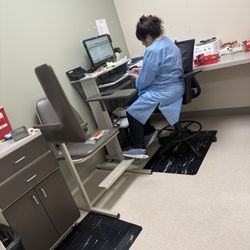 On her phone instead of doing her job