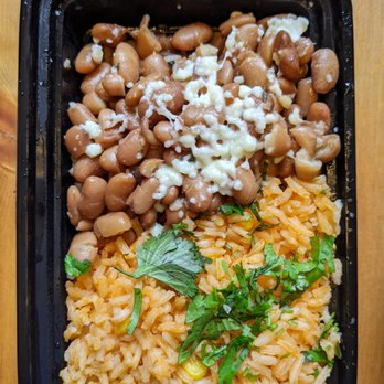 Fonda La Catrina - Rice & Beans: classic beans topped with queso fresco & cilantro. Rice with tomato, peas, carrots. - Mexican Near Me - Seattle, Washington Fonda La Catrina - Rice & Beans: classic beans topped with queso fresco & cilantro. Rice with tomato, peas, carrots. - Mexican Near Me - Seattle, Washington