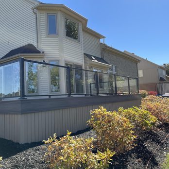 Building's By Ed Slanec - a view of a house with a large deck - Painters Near Me - Fraser, Michigan Building's By Ed Slanec - a view of a house with a large deck - Painters Near Me - Fraser, Michigan