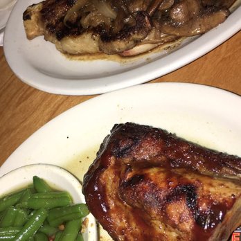 Texas Roadhouse - Ribeye topped with mushrooms and onions and a pairing side of ribs - American Near Me - Boynton Beach, Florida