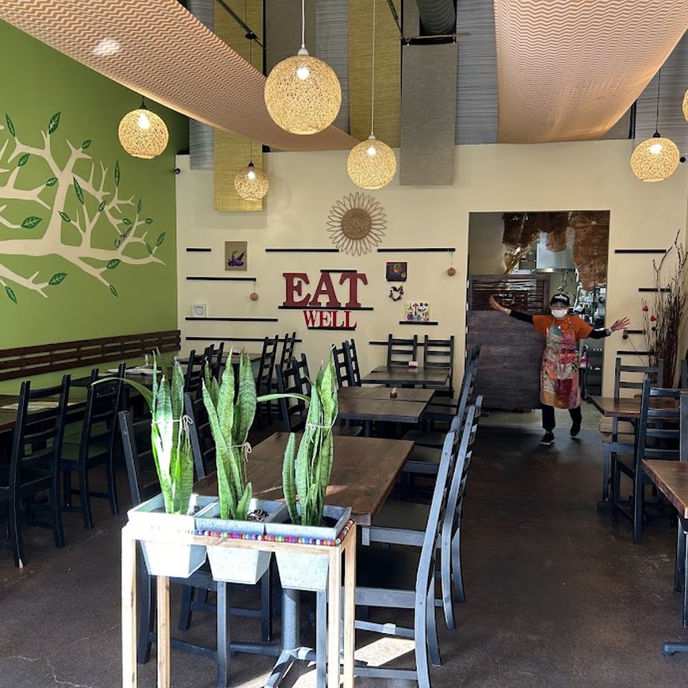 Manager Atsuko and the interior of this cheery, comfy place. Manager Atsuko and the interior of this cheery, comfy place.