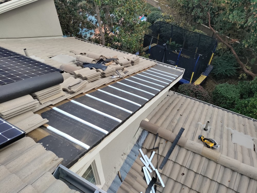 Slide of Quinn Bro's Roofing