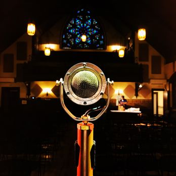 The Stone Church - a microphone in front of a stained glass window - Music Venues Near Me - Brattleboro, Vermont The Stone Church - a microphone in front of a stained glass window - Music Venues Near Me - Brattleboro, Vermont