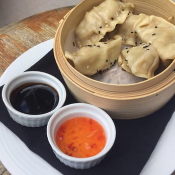 Rundle Bar - Potstickers on the side patio between the Rundle Lounge and the croquet lawn. - Lounges Near Me - Banff, Alberta Rundle Bar - Potstickers on the side patio between the Rundle Lounge and the croquet lawn. - Lounges Near Me - Banff, Alberta