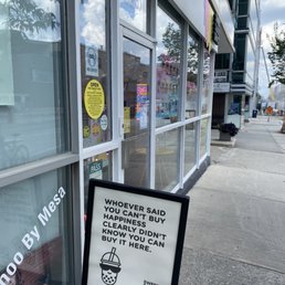 a sign in front of a store a sign in front of a store