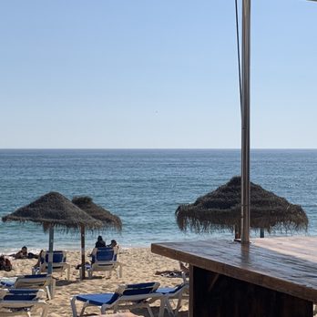 Wax Restobar - Dining on the deck in the back facing the ocean. - Lounges Near Me - Faro, 08