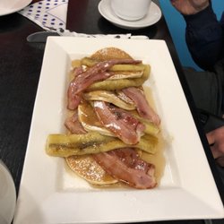 The Village Cafe - Pancakes with bananas and bacon and maple syrup with a side of deeelicious!