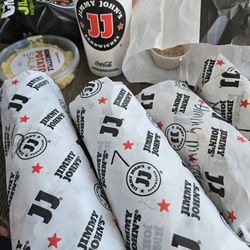 Jimmy John's - Reg club tuna, reg east coast Italian and two lil John tuna clubs one without cucumber and tomato.