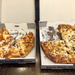 Royal Pizza - Medium Texan on the left, Large Meat Lovers on the right. These pizzas are so filling!