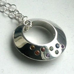 Jewelryclassdc - Hollow sterling ring flush set with sapphires.