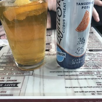 Black Sheep Pub And Grill - a glass of beer and a can of black sheep - Pubs Near Me - Green Bay, Wisconsin