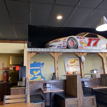 Foster's Grille - Partial view of interior of restaurant, including self-serve fountain drink area. Not sure why there's a car above the tables. Feb, 2026. - Burgers Near Me - Marshall, Virginia