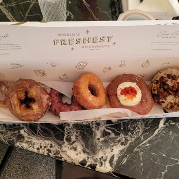 Sidecar Doughnuts & Coffee - Six pack from left to right; Vanilla Twist, Old Fashion, Huckleberry, Butter & Salt, Sugarfina Bullseye, Maple Bacon - Donuts Near Me - Costa Mesa, California