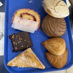 a blue tray with a variety of pastries a blue tray with a variety of pastries