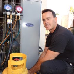 Johnson Air Systems - Paul performing a service on a Carrier unit- we work on all makes and models!