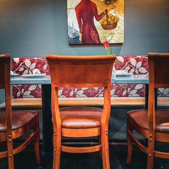 Lemon Grass Restaurant - a table and chairs with a painting on the wall - Asian Fusion Near Me - Sacramento, California Lemon Grass Restaurant - a table and chairs with a painting on the wall - Asian Fusion Near Me - Sacramento, California
