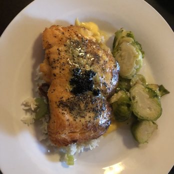 Maxine's On Shine - Salmon A La George (rice pilaf, Brussels sprouts, and spicy hollandaise sauce). - New American Near Me - Orlando, Florida Maxine's On Shine - Salmon A La George (rice pilaf, Brussels sprouts, and spicy hollandaise sauce). - New American Near Me - Orlando, Florida
