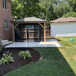 Madrid’s Landscaping - after wood deck was removed and bricks and pergola installed