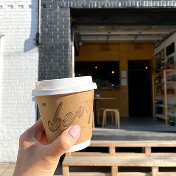 Bevy - a hand holding a cup of coffee - Coffee & Tea Near Me - Toronto, Ontario