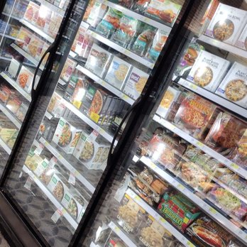 Target - A glass-door freezer in a grocery store contains various frozen food items, including pizzas and meals, with visible product packaging. - Furniture Stores Near Me - Brooklyn, New York