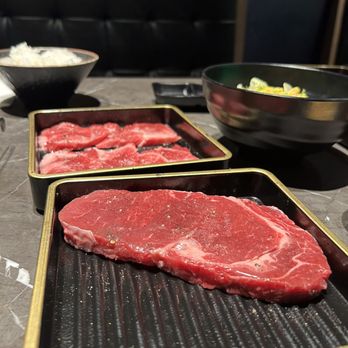 Niku Feast Yakiniku - Ribeye steak (closest on the picture) Karubi (further on the picture) - Barbeque Near Me - Seattle, Washington Niku Feast Yakiniku - Ribeye steak (closest on the picture) Karubi (further on the picture) - Barbeque Near Me - Seattle, Washington