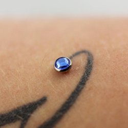 Heroes & Villains Tattoo & Piercing - Healed micro-dermal anchor done by PiercerDan to accent a tattoo